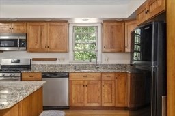 6 Mellen Street Hopedale, MA 01747 - Photo 6 of 42 a kitchen with stainless steel appliances granite countertop a stove a sink and a microwave
