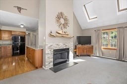6 Mellen Street Hopedale, MA 01747 - Photo 8 of 42 a living room with furniture a fireplace and a flat screen tv