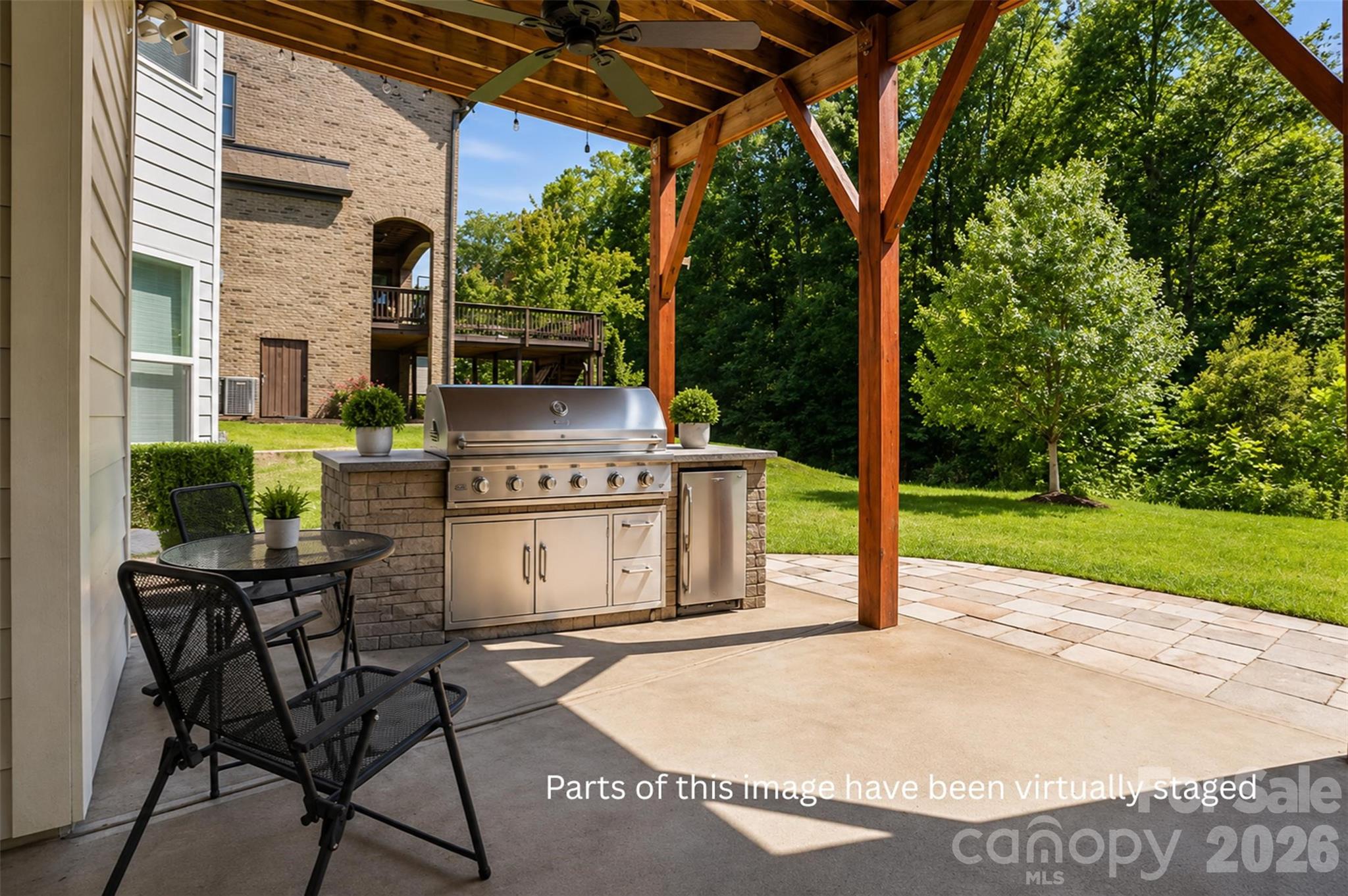 14022 Salem Ridge Road Huntersville, NC 28078 - Photo 37 of 38 a view of a chair and table in the patio with a garden