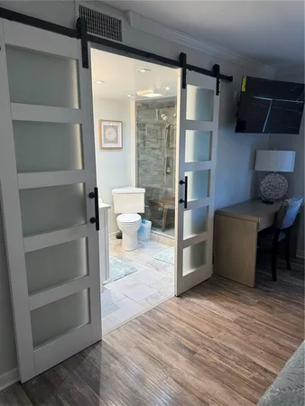 a kitchen with stainless steel appliances a stove and a refrigerator