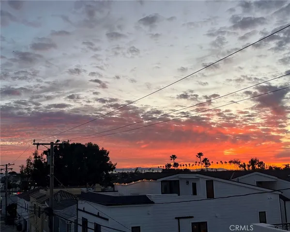 a view of a pathway of house with flower pots
