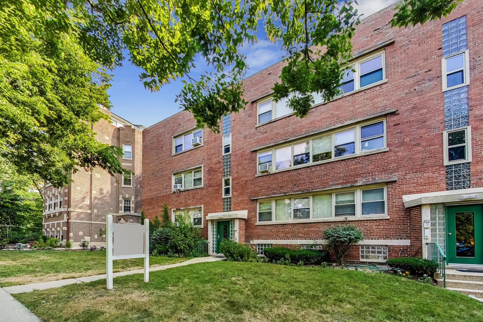 205 Custer Avenue, Unit 3 Evanston, IL 60202 - Photo 1 of 12 front view of a house with a yard