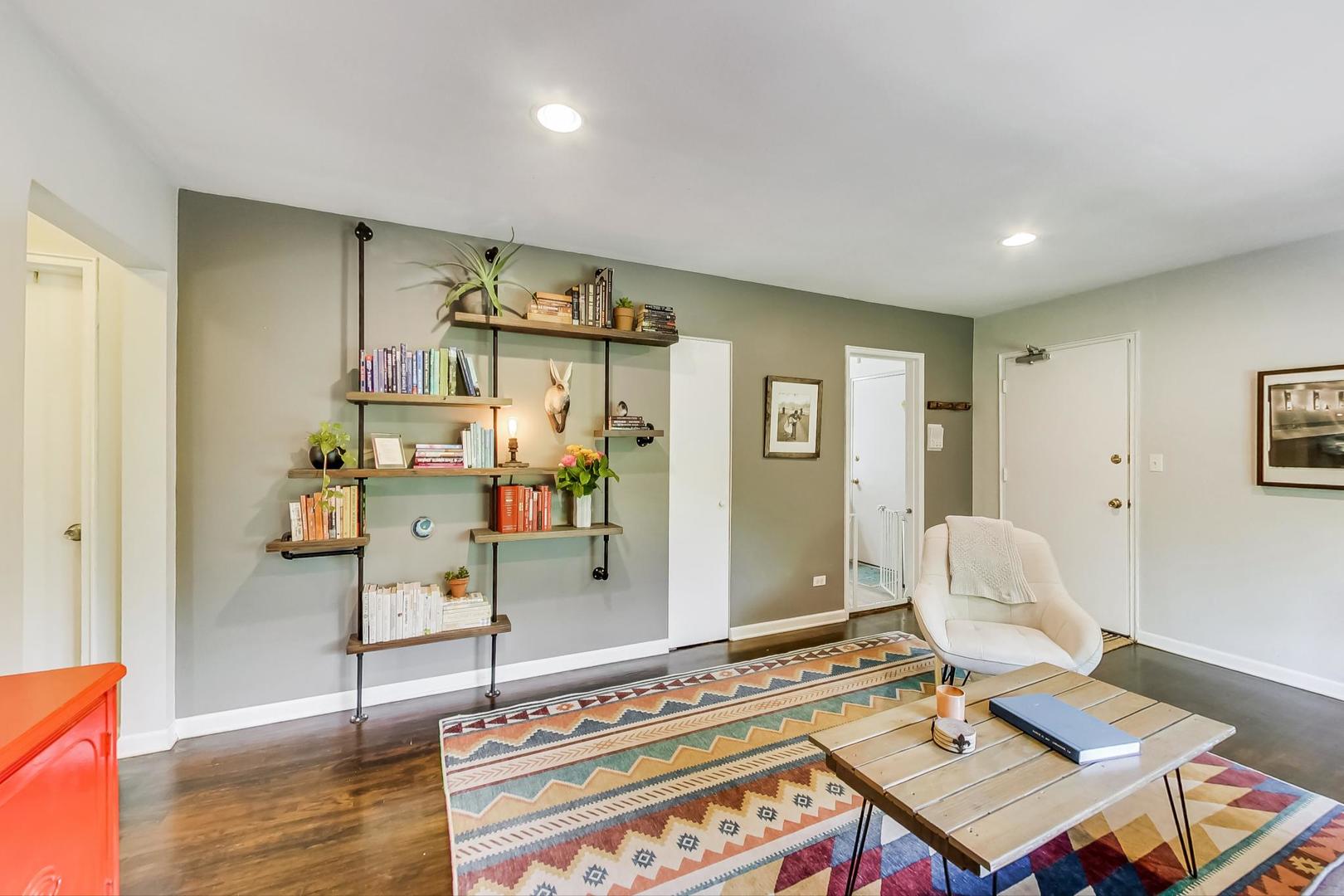 205 Custer Avenue, Unit 3 Evanston, IL 60202 - Photo 5 of 12 a workspace with furniture and wooden floor