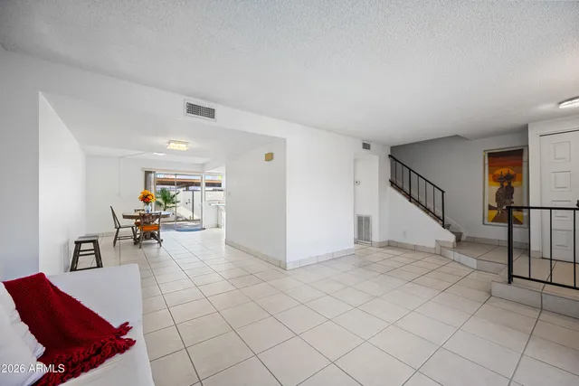 a view of a livingroom with furniture and lounge chair