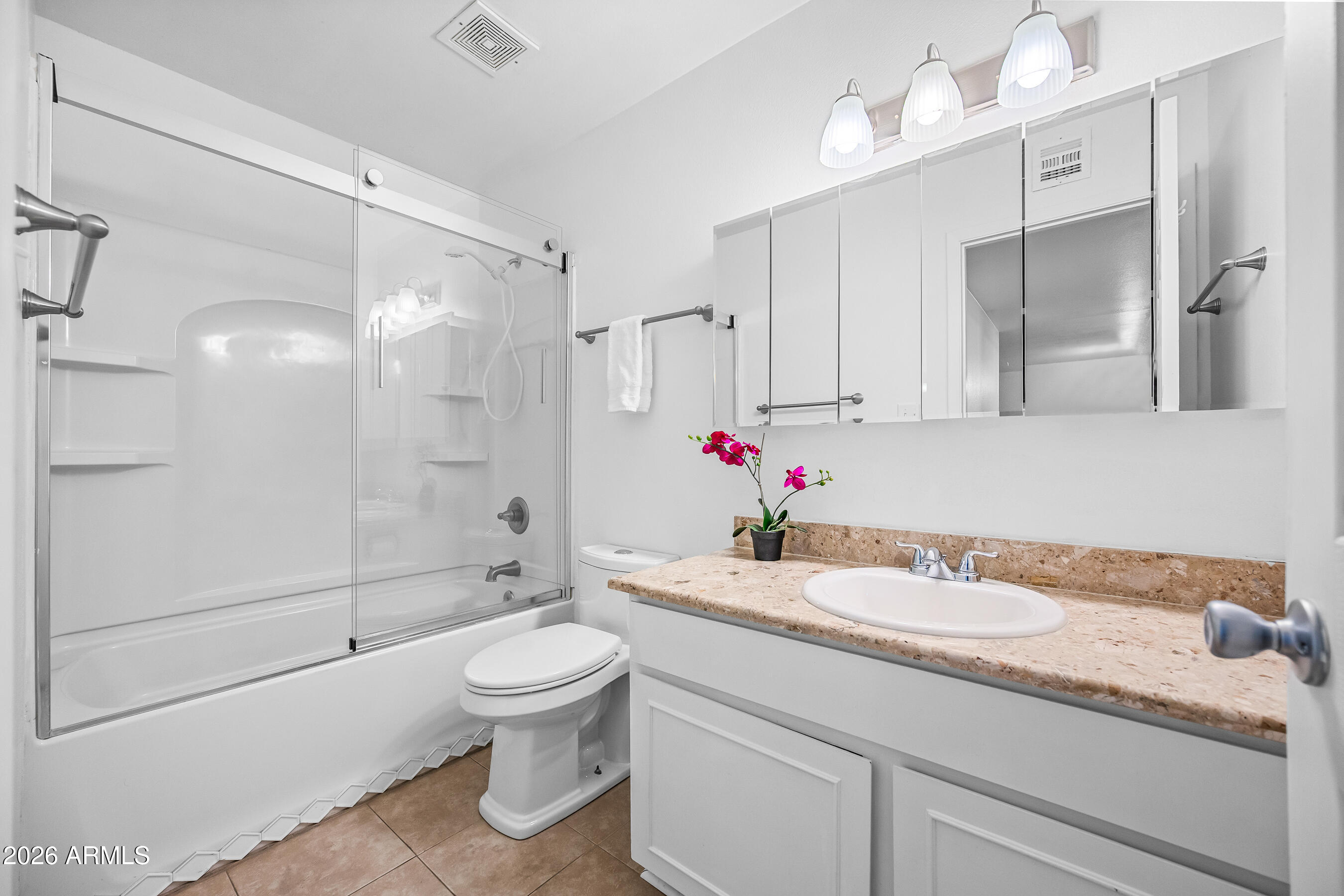 4815 South Birch Street Tempe, AZ 85282 - Photo 22 of 25 a bathroom with a granite countertop sink a toilet and shower