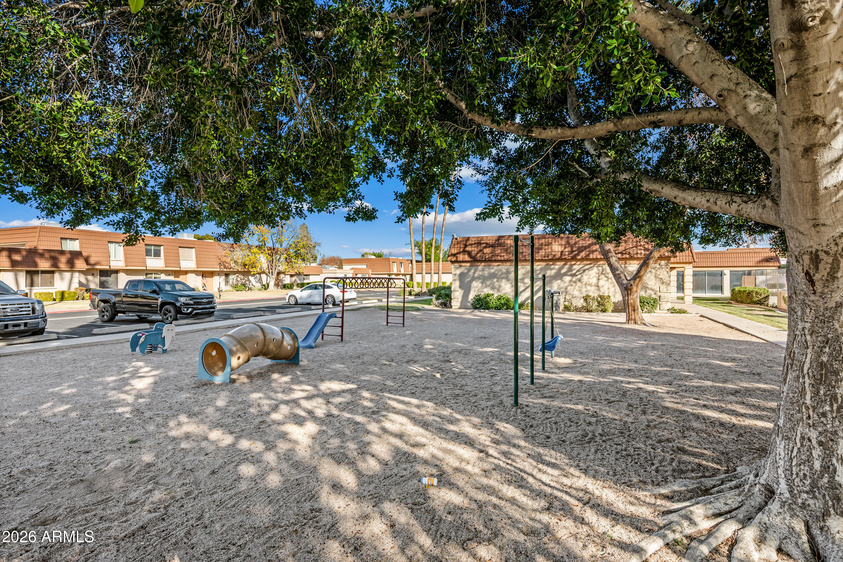 4815 South Birch Street Tempe, AZ 85282 - Photo 24 of 25 a view of a park with swings and bench