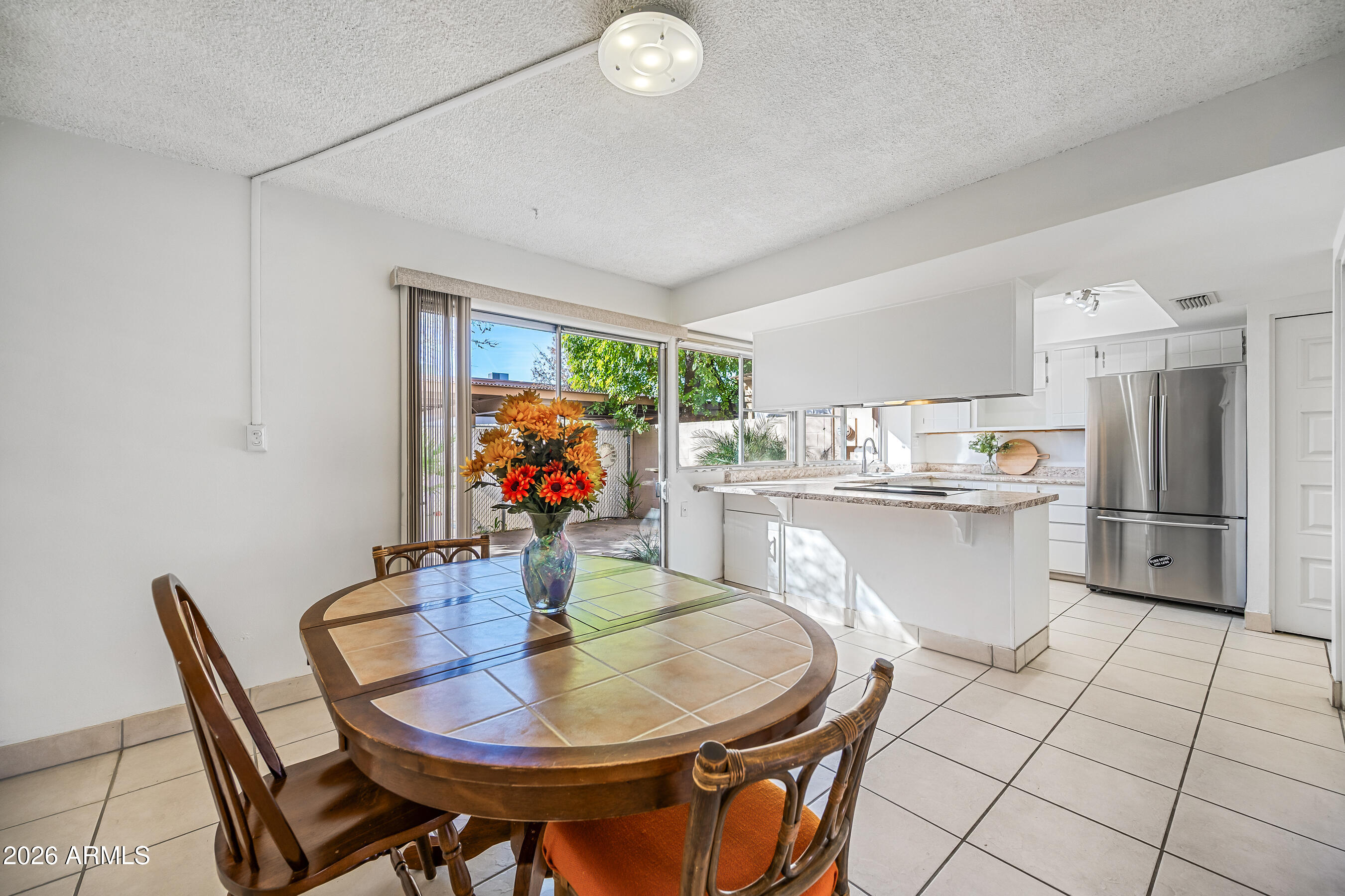 4815 South Birch Street Tempe, AZ 85282 - Photo 3 of 25 a dining room with furniture and wooden floor