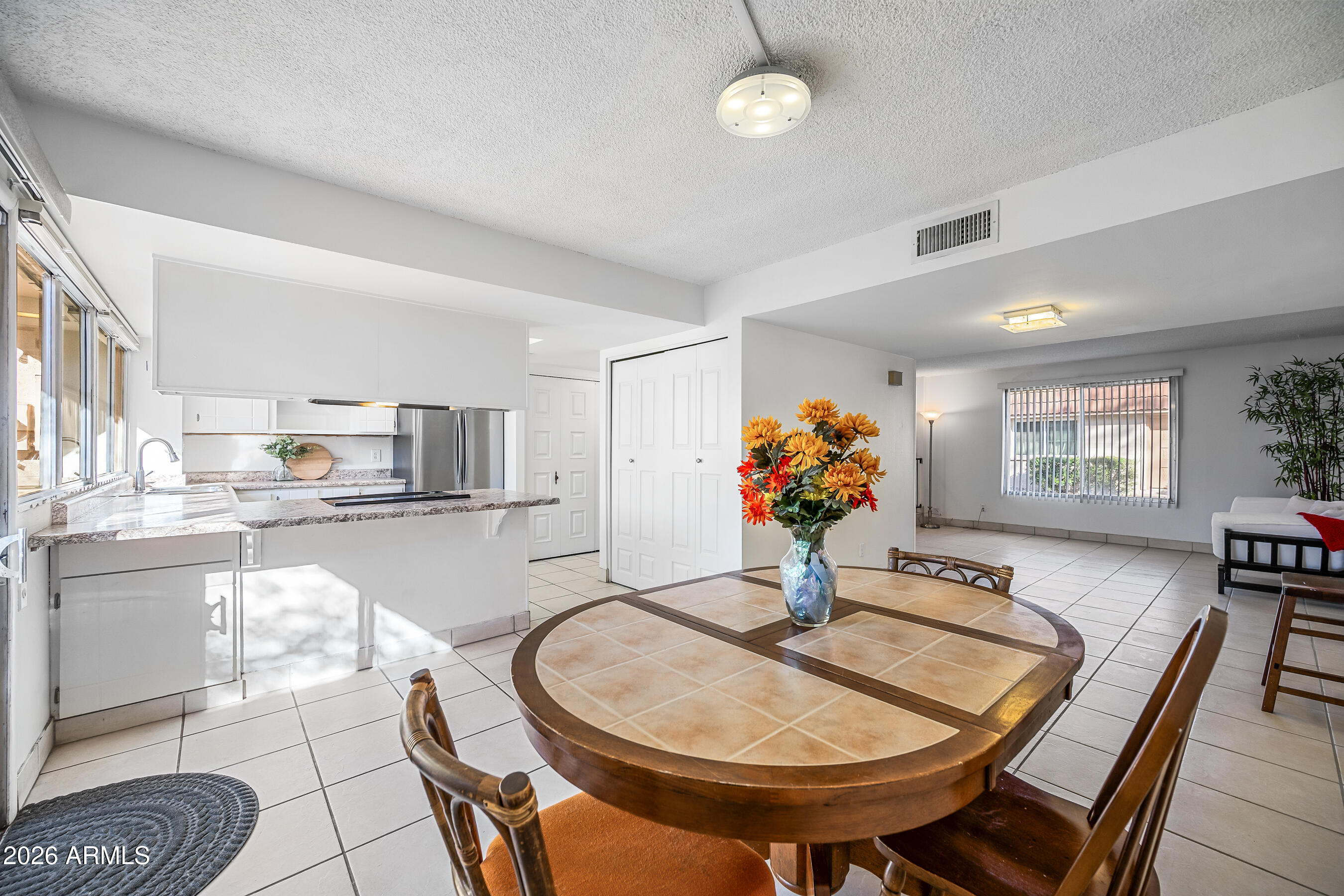 4815 South Birch Street Tempe, AZ 85282 - Photo 6 of 25 a dining room filled chandelier and wooden floor