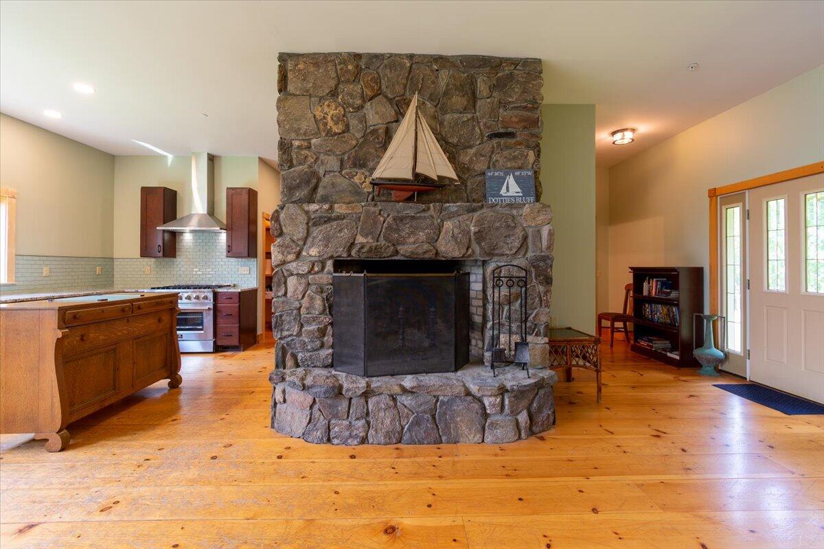 Grand field stone fireplace.