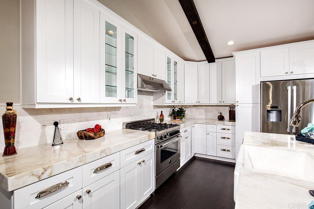 768 Devonshire Drive Encinitas, CA 92024 - Photo 11 of 30 a kitchen with granite countertop a sink stainless steel appliances and cabinets