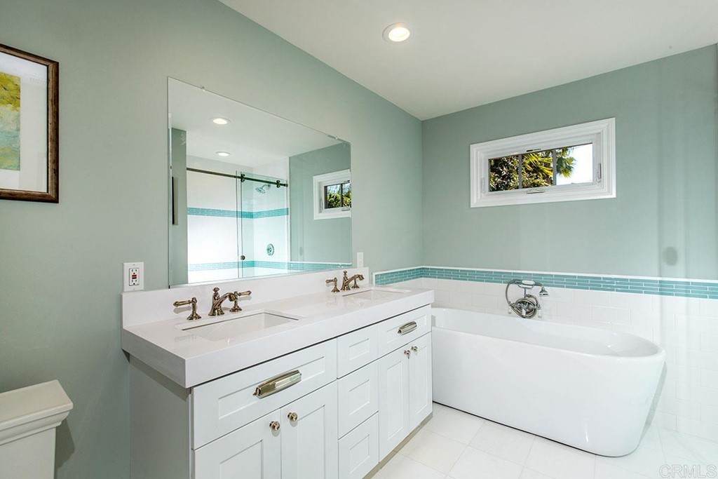 768 Devonshire Drive Encinitas, CA 92024 - Photo 19 of 30 a bathroom with a sink and a mirror
