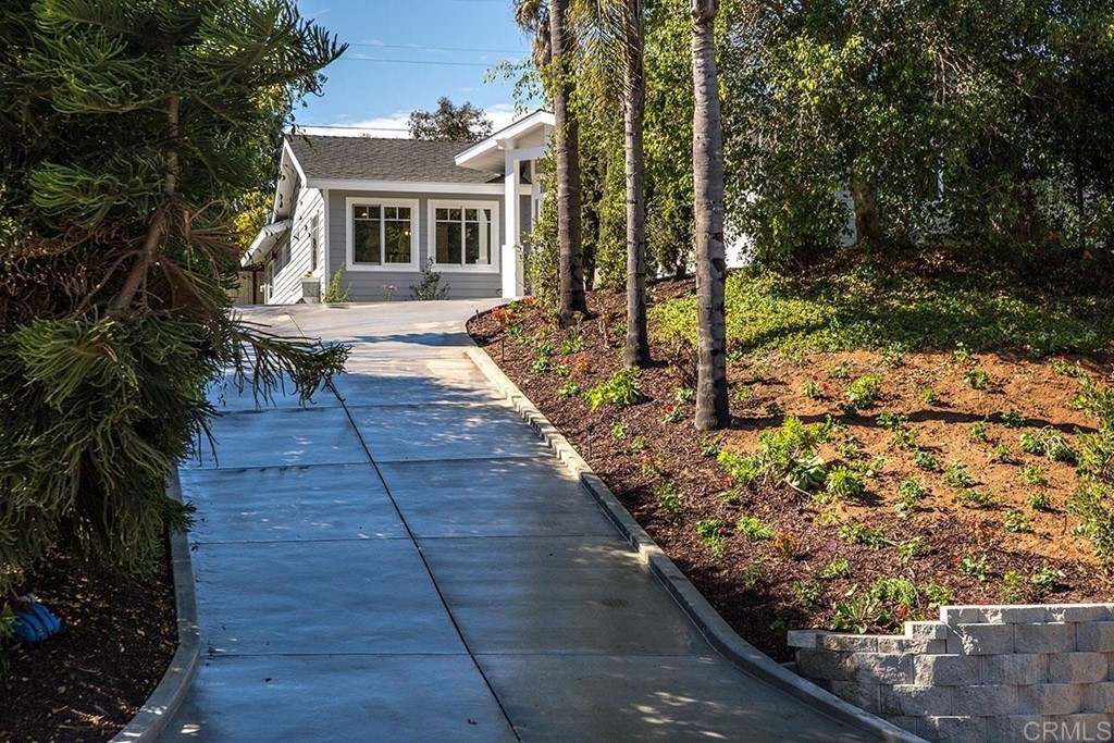 768 Devonshire Drive Encinitas, CA 92024 - Photo 24 of 30 a front view of a house with a yard