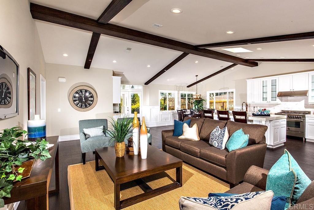 768 Devonshire Drive Encinitas, CA 92024 - Photo 5 of 30 a living room with furniture and a clock