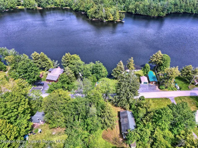a view of a livingroom with furniture and a window