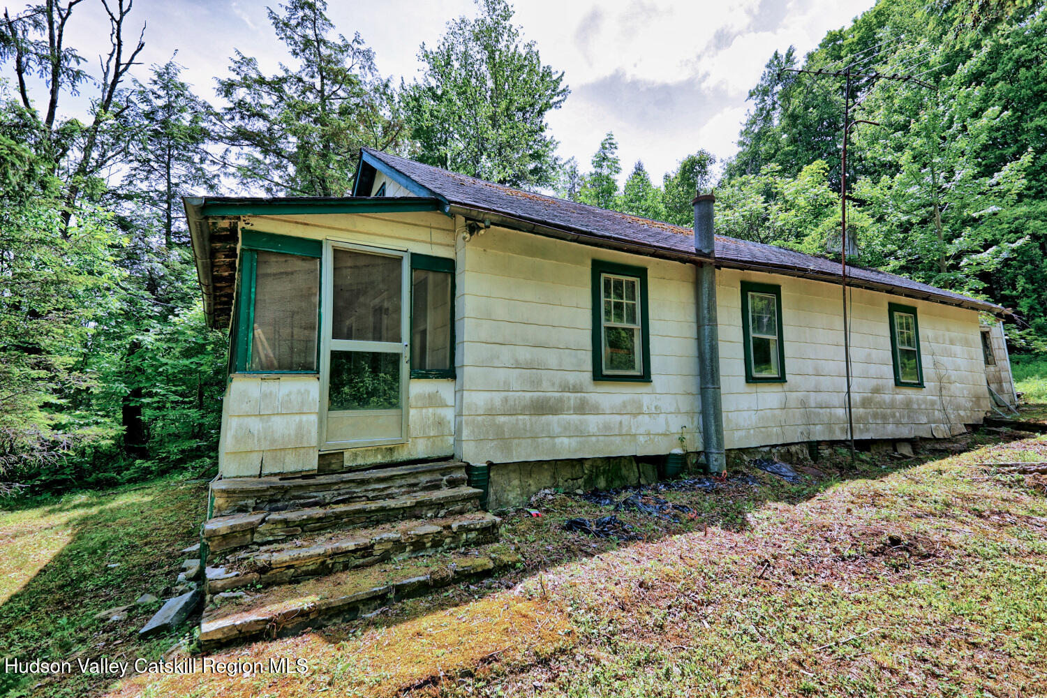 145 Lake Road Berne, NY 12023 - Photo 8 of 66 a front view of a house with a garden