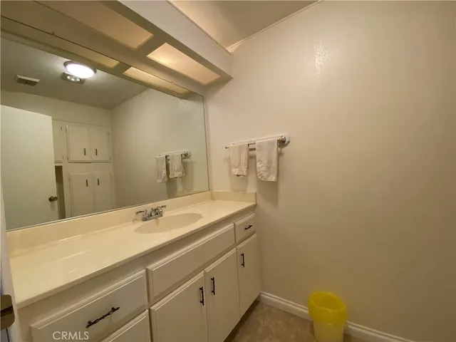 a bathroom with a sink and mirror