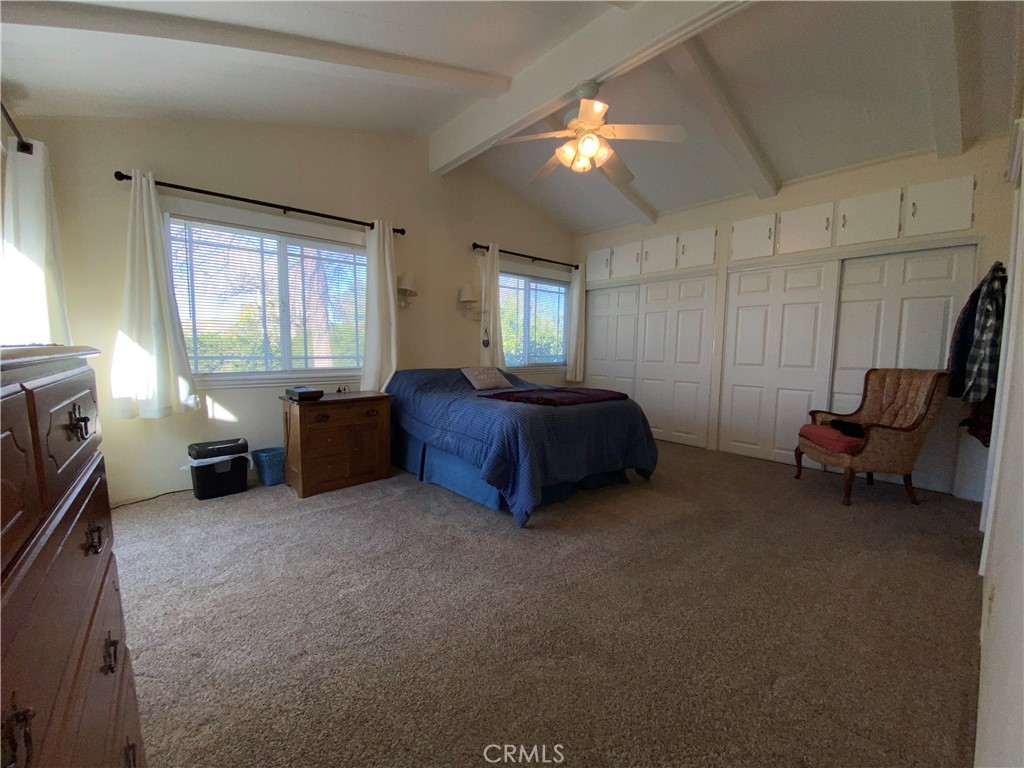 9607 Rosedale Drive Calimesa, CA 92320 - Photo 20 of 27 a bed room with a bed and a chair