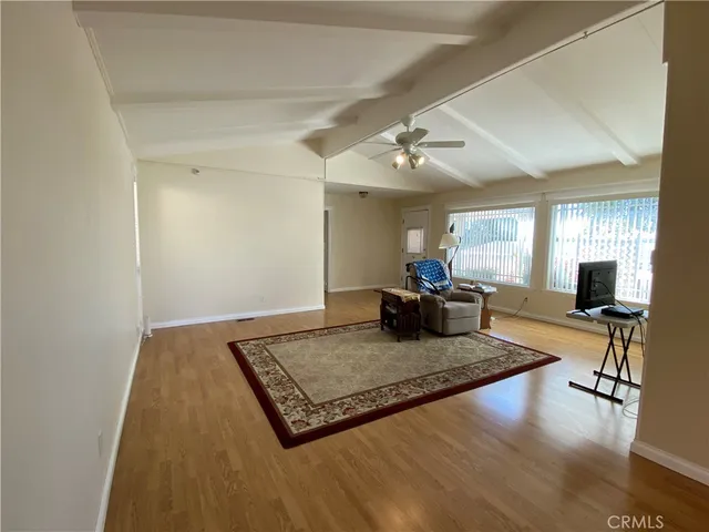 a living room with dining table