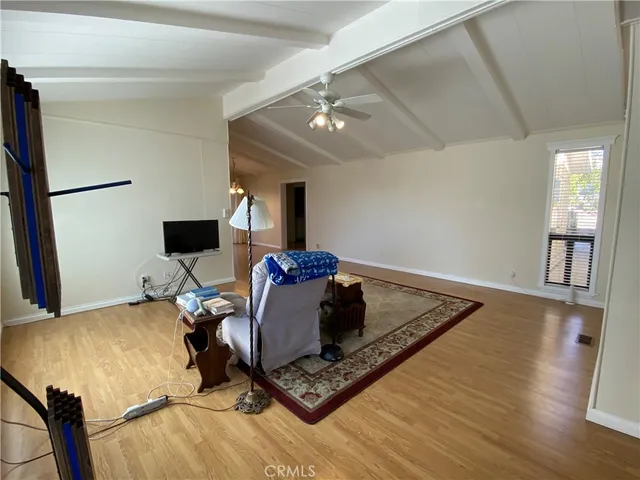 a bed room with a bed window and a chair