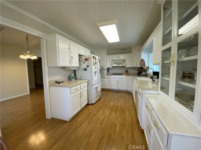 a view of a kitchen with wooden floor