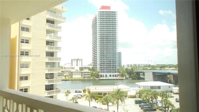 a view of a lake with tall buildings