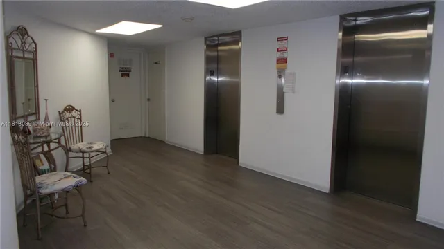 a view of a livingroom with furniture a table and chairs