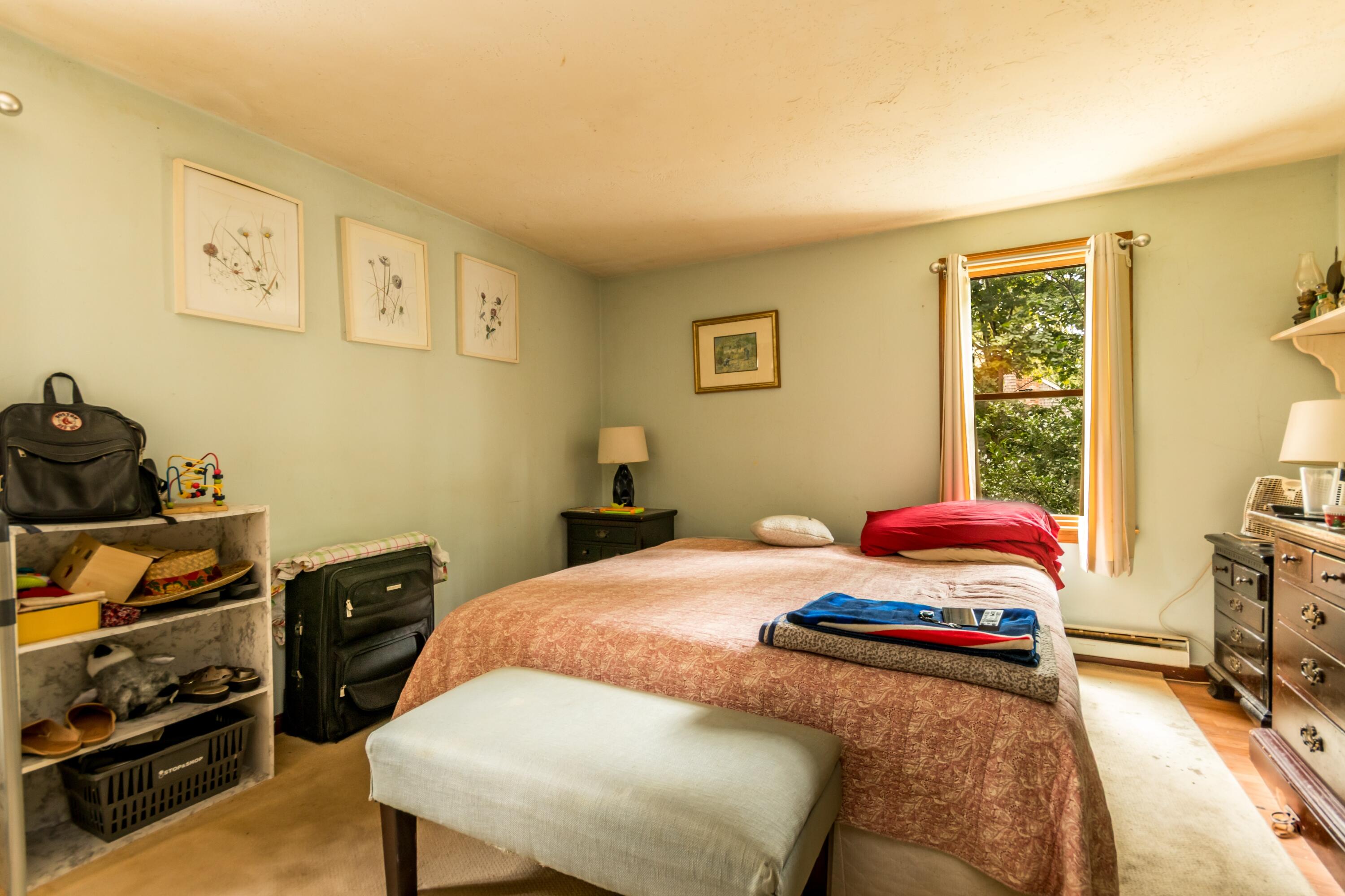 66 Braxton Road East Falmouth, MA 02536 - Photo 11 of 17 a bedroom with a bed and wooden floor