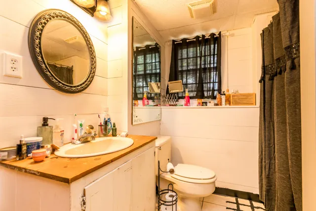 a bedroom with a bed and chair