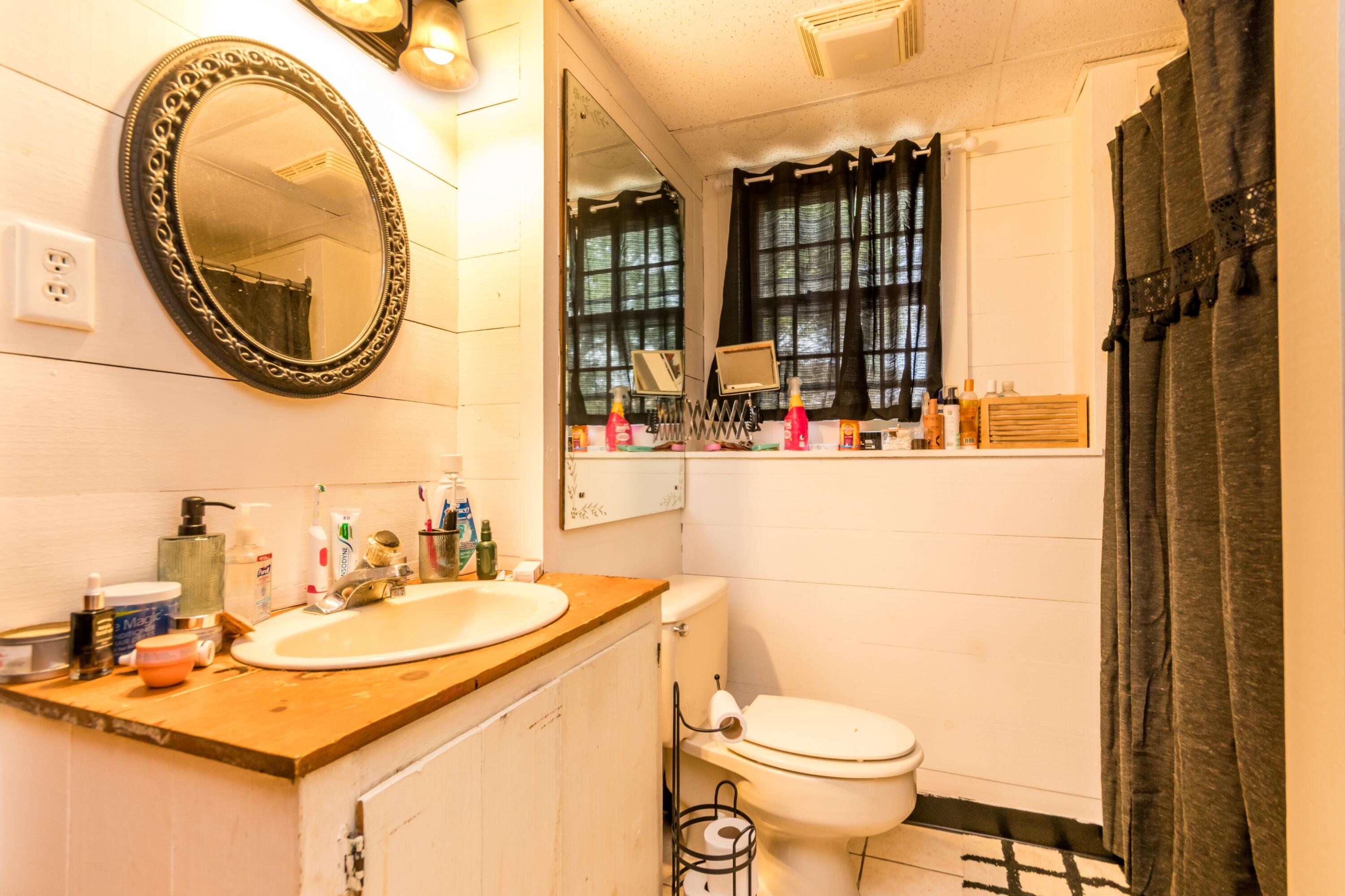 66 Braxton Road East Falmouth, MA 02536 - Photo 15 of 17 a bathroom with a sink and a mirror