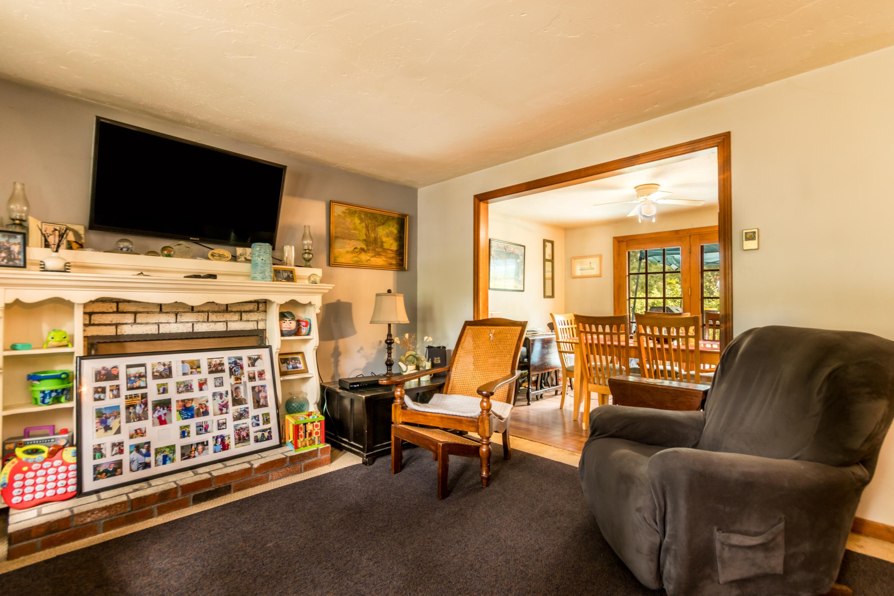 66 Braxton Road East Falmouth, MA 02536 - Photo 7 of 17 a living room with furniture and a flat screen tv