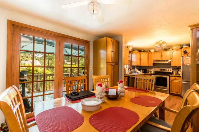 a living room with furniture and floor to ceiling windows
