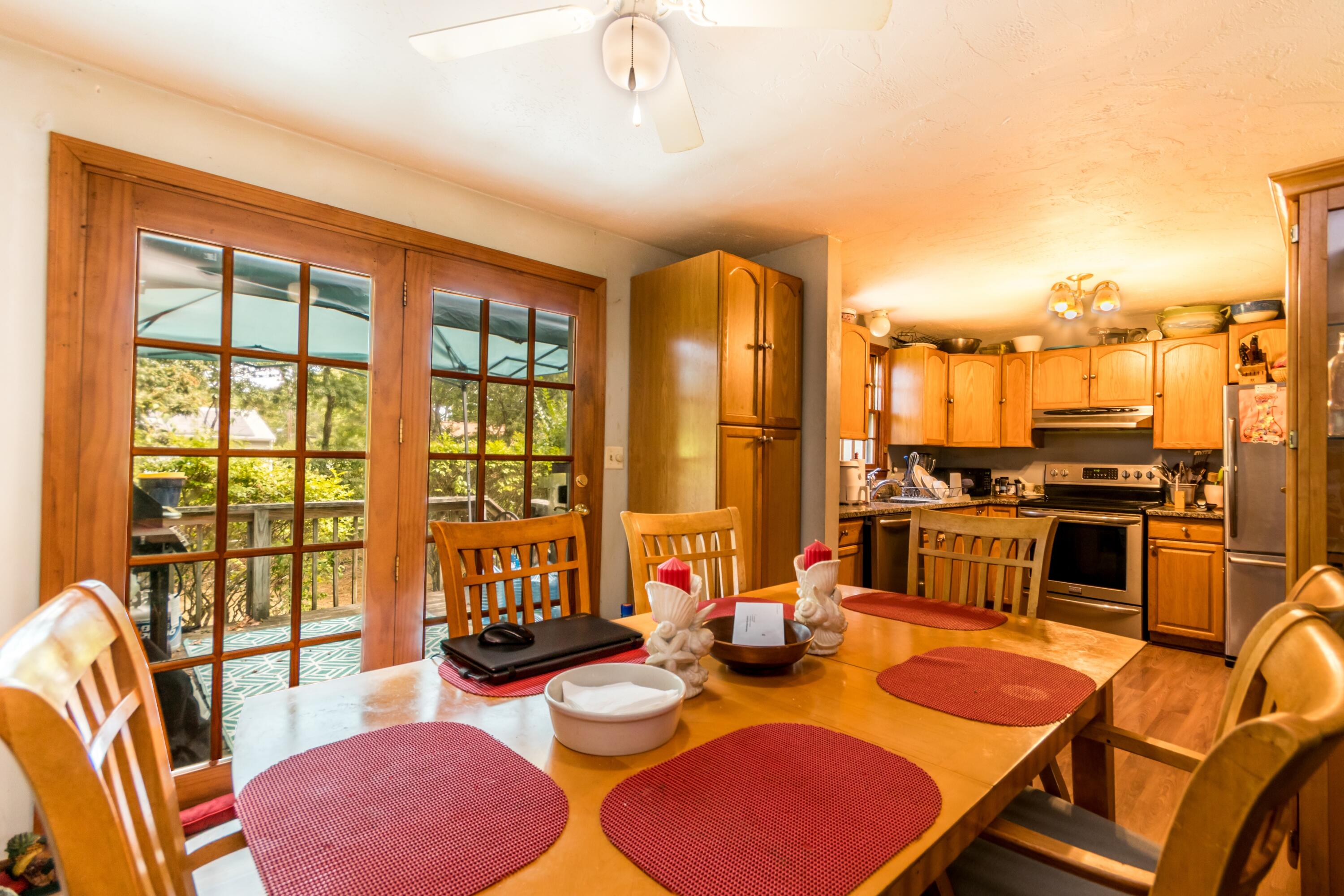 66 Braxton Road East Falmouth, MA 02536 - Photo 8 of 17 a living room with furniture and floor to ceiling windows