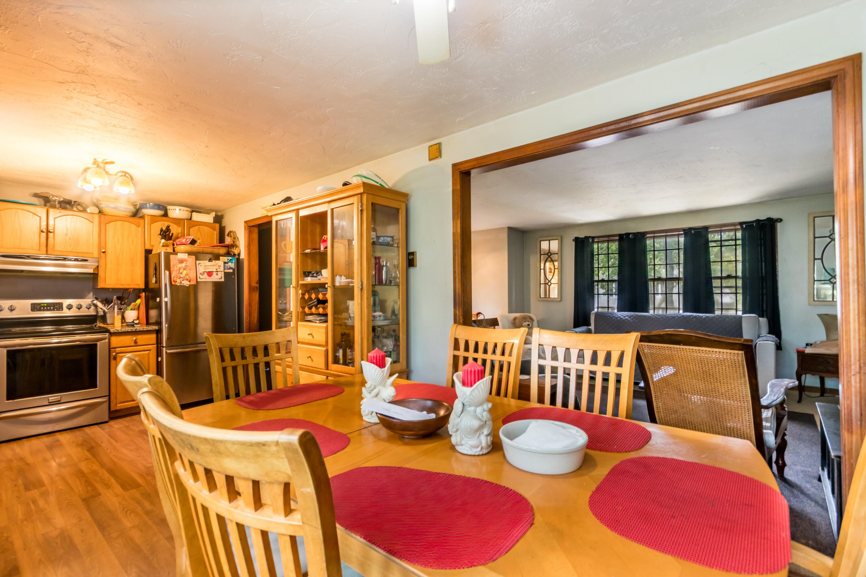 66 Braxton Road East Falmouth, MA 02536 - Photo 17 of 17 a dining room with furniture and a floor to ceiling window