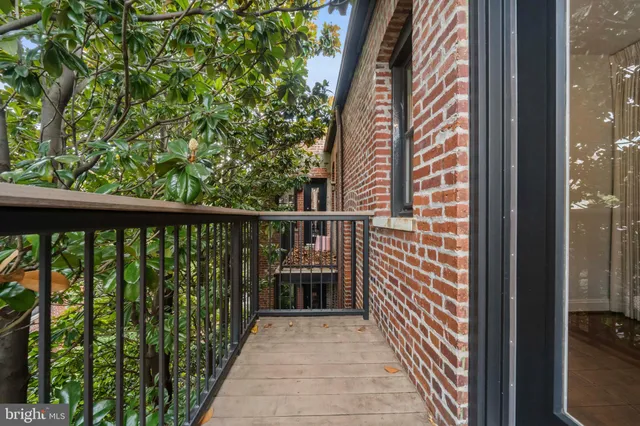a view of balcony with wooden floor