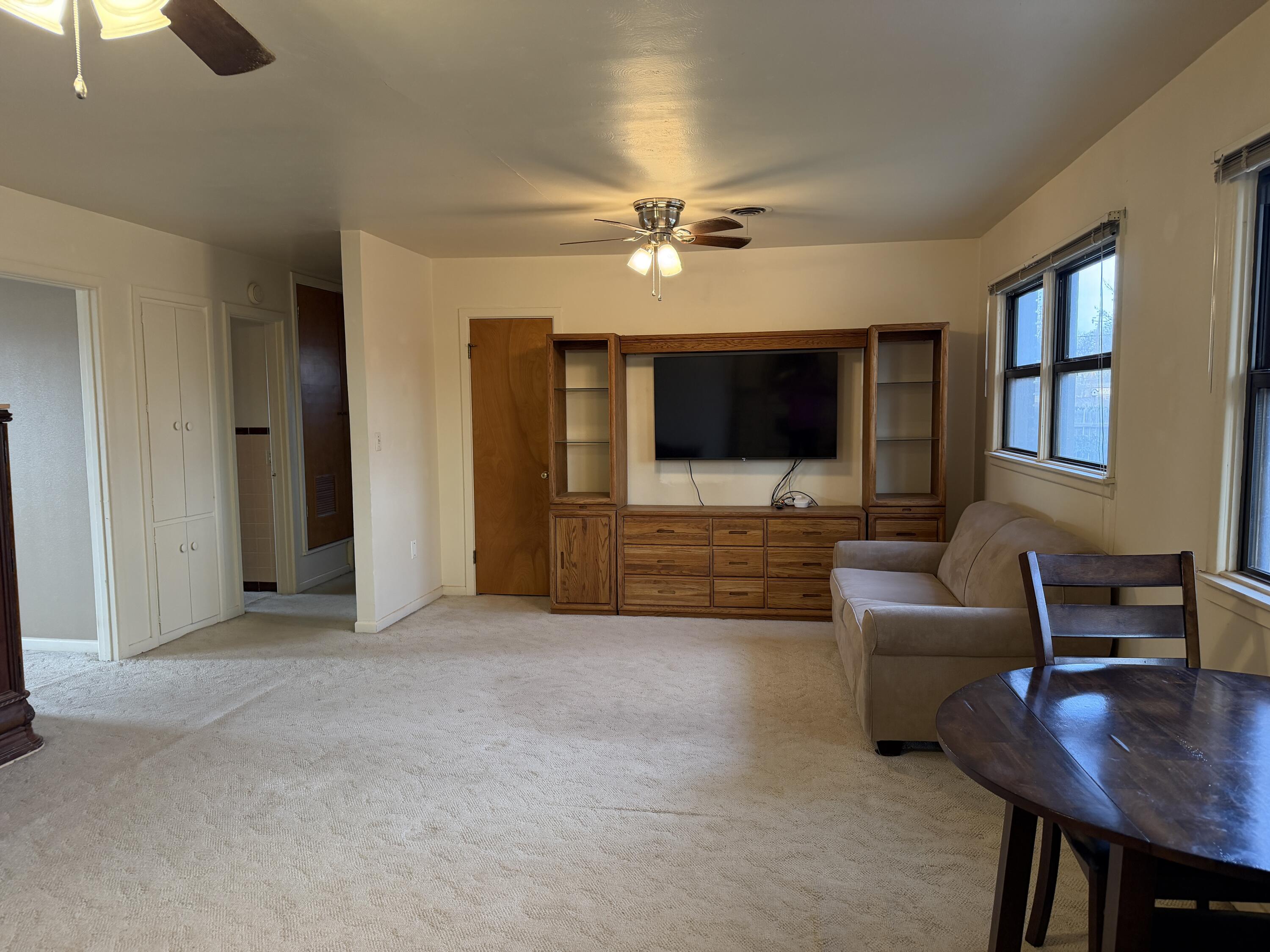 303 North 21st Place Lamesa, TX 79331 - Photo 11 of 35 a living room with furniture and a flat screen tv