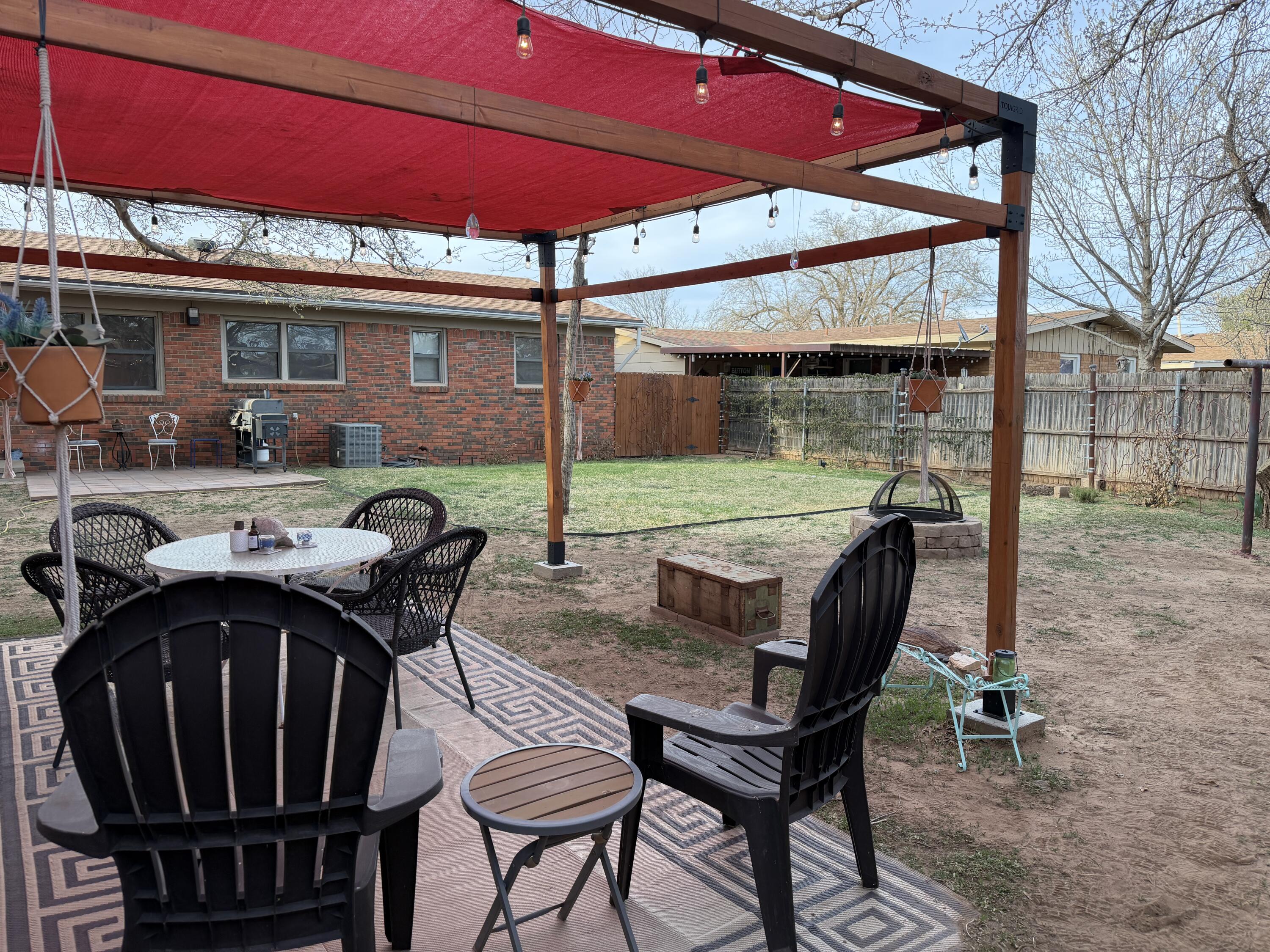 303 North 21st Place Lamesa, TX 79331 - Photo 29 of 35 a view of an outside dining space with furniture and backyard