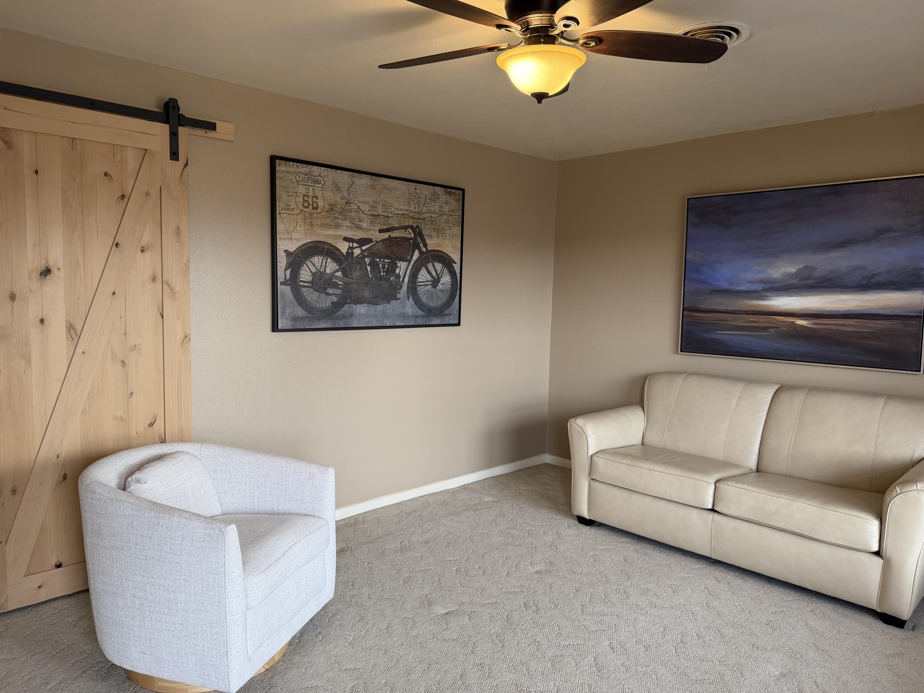 303 North 21st Place Lamesa, TX 79331 - Photo 5 of 35 a living room with furniture and a ceiling fan