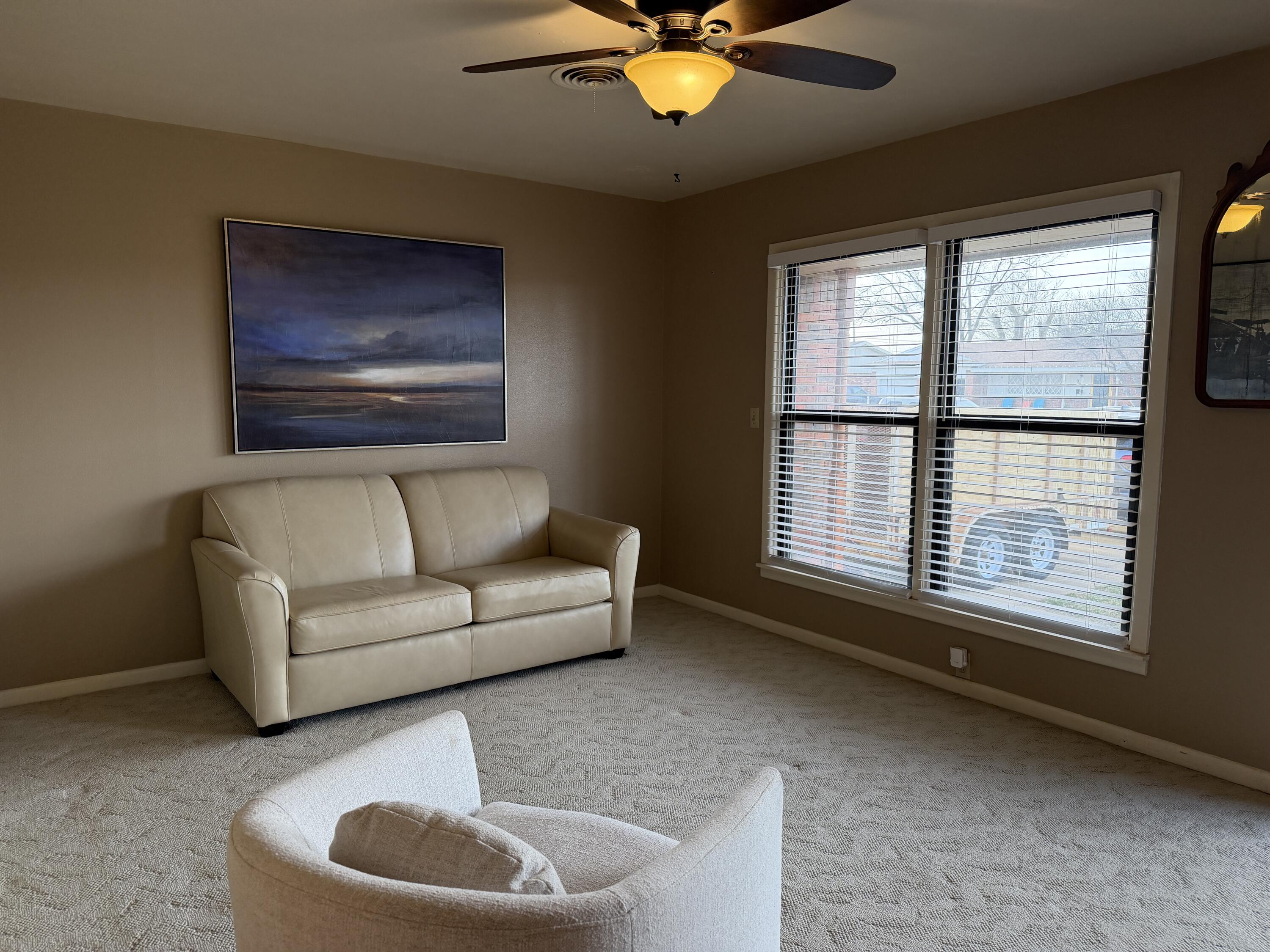 303 North 21st Place Lamesa, TX 79331 - Photo 6 of 35 a living room with furniture and a large window