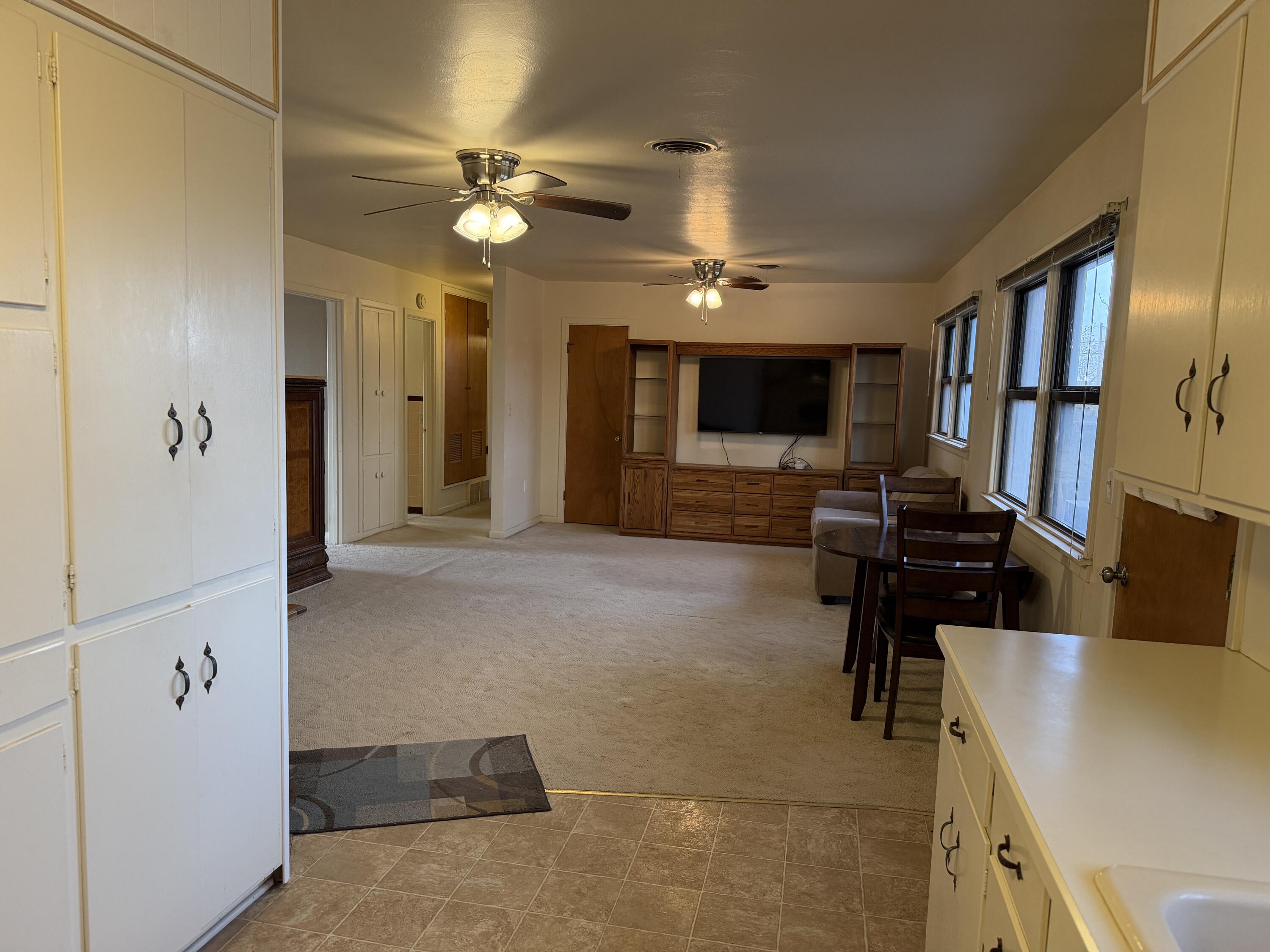 303 North 21st Place Lamesa, TX 79331 - Photo 8 of 35 a view of a livingroom with workspace and a window