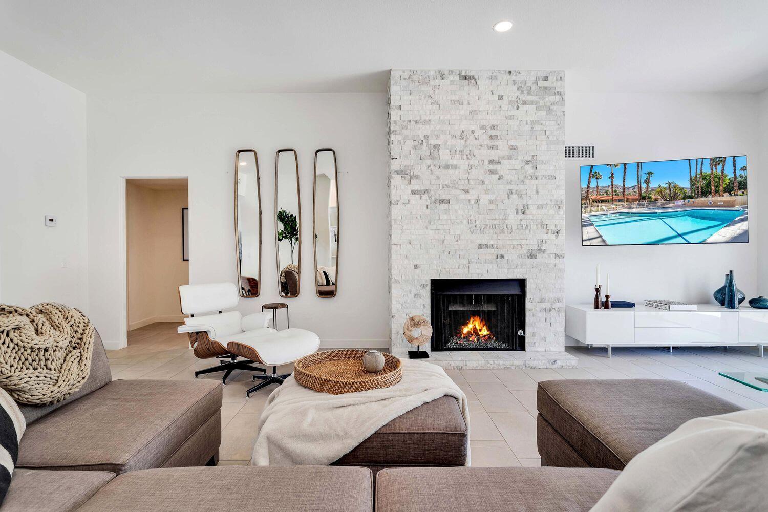 3350 Bogert Trail Palm Springs, CA 92264 - Photo 1 of 21 a living room with furniture and fireplace