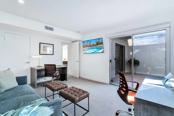 a living room with furniture and a window
