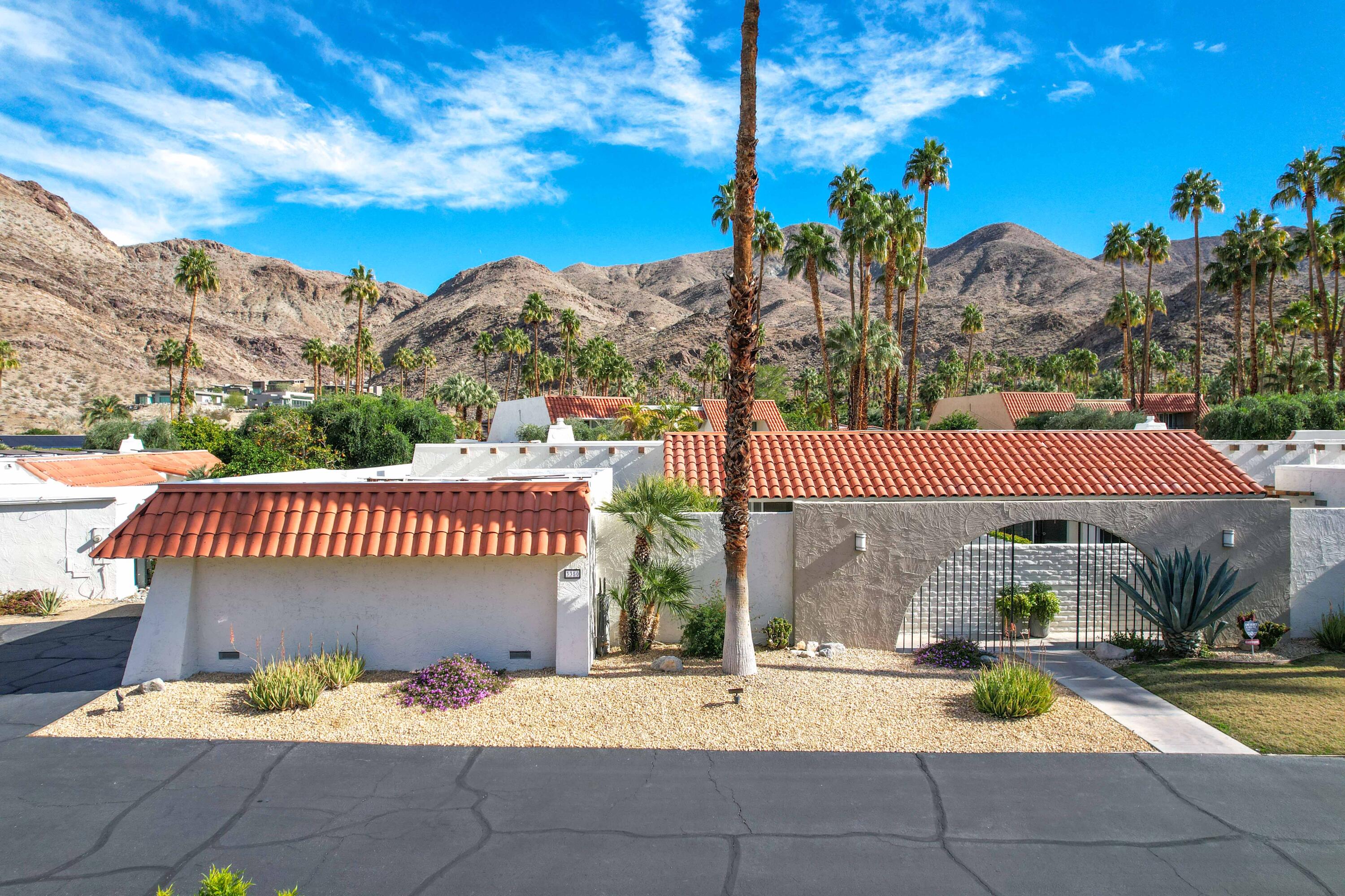 3350 Bogert Trail Palm Springs, CA 92264 - Photo 19 of 21 a view of a patio with a table and chairs