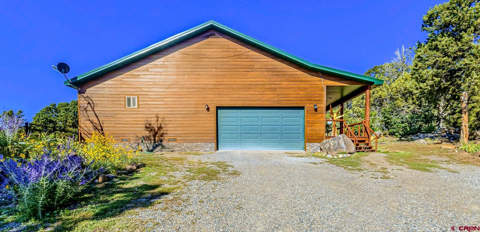 20613 High Park Road Cedaredge, CO 81413 - Photo 26 of 35 a front view of a house with a yard