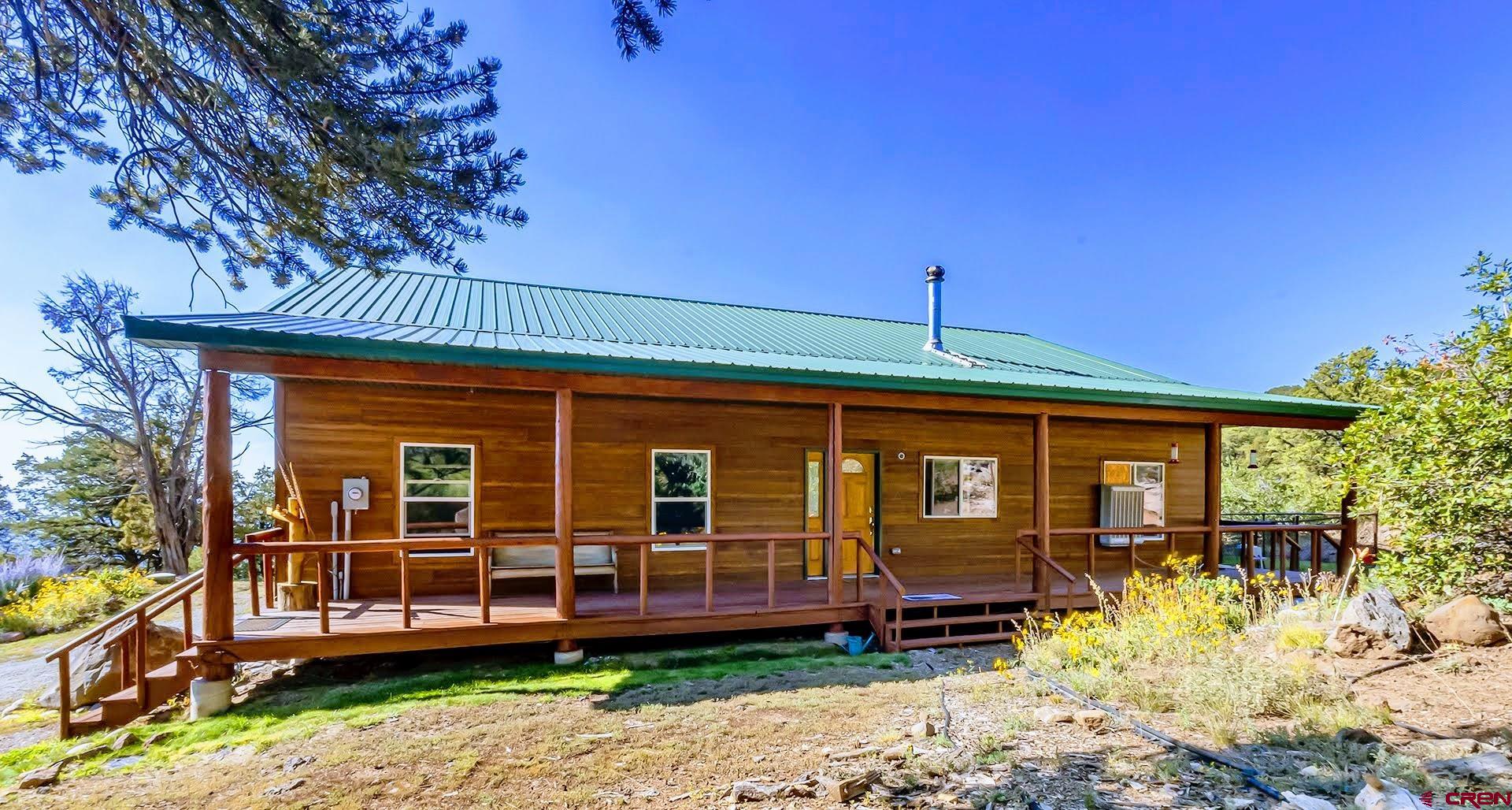 20613 High Park Road Cedaredge, CO 81413 - Photo 4 of 35 front view of a house with a small yard