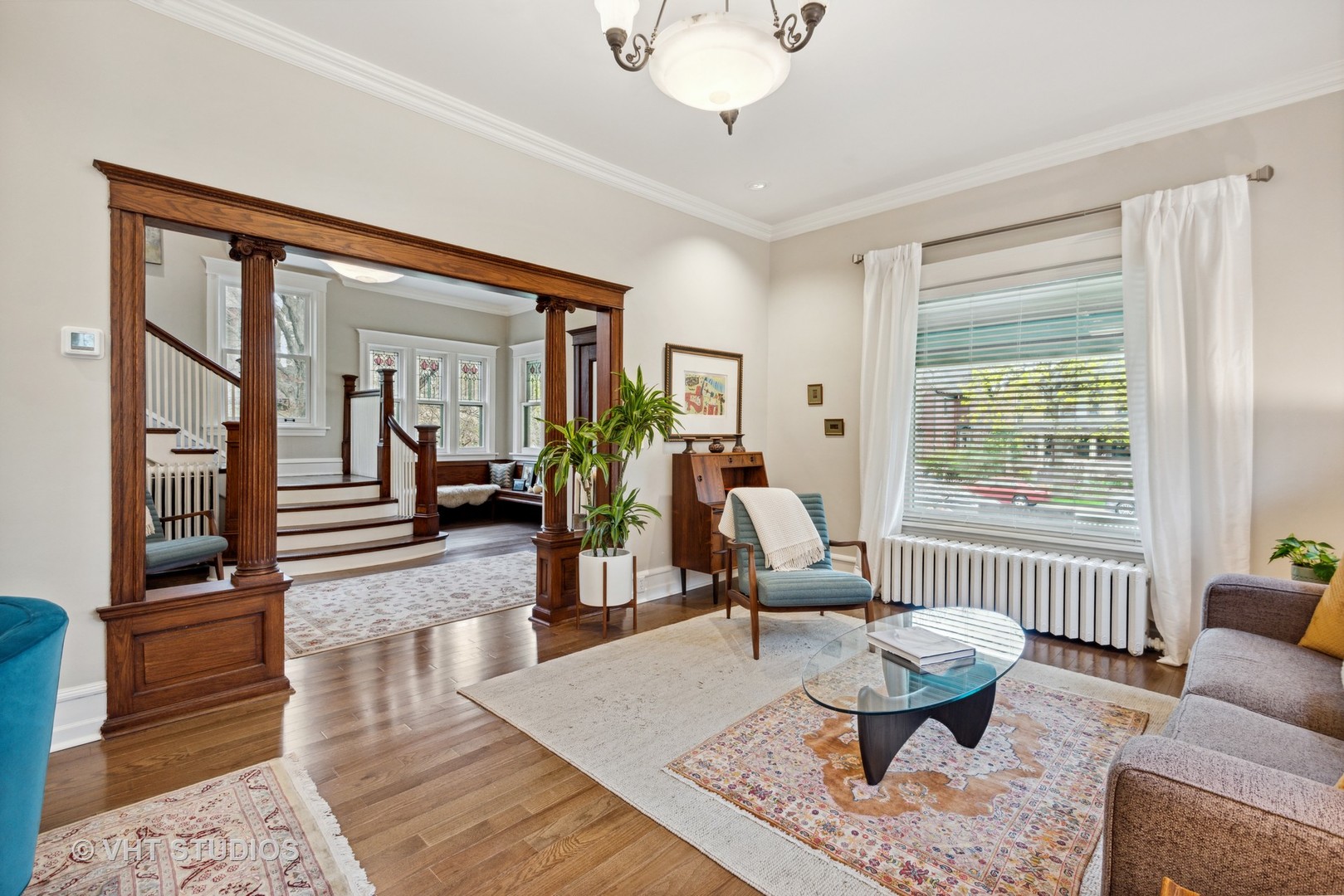 1224 Maple Avenue Evanston, IL 60202 - Photo 13 of 71 a living room with furniture a table and wooden floor