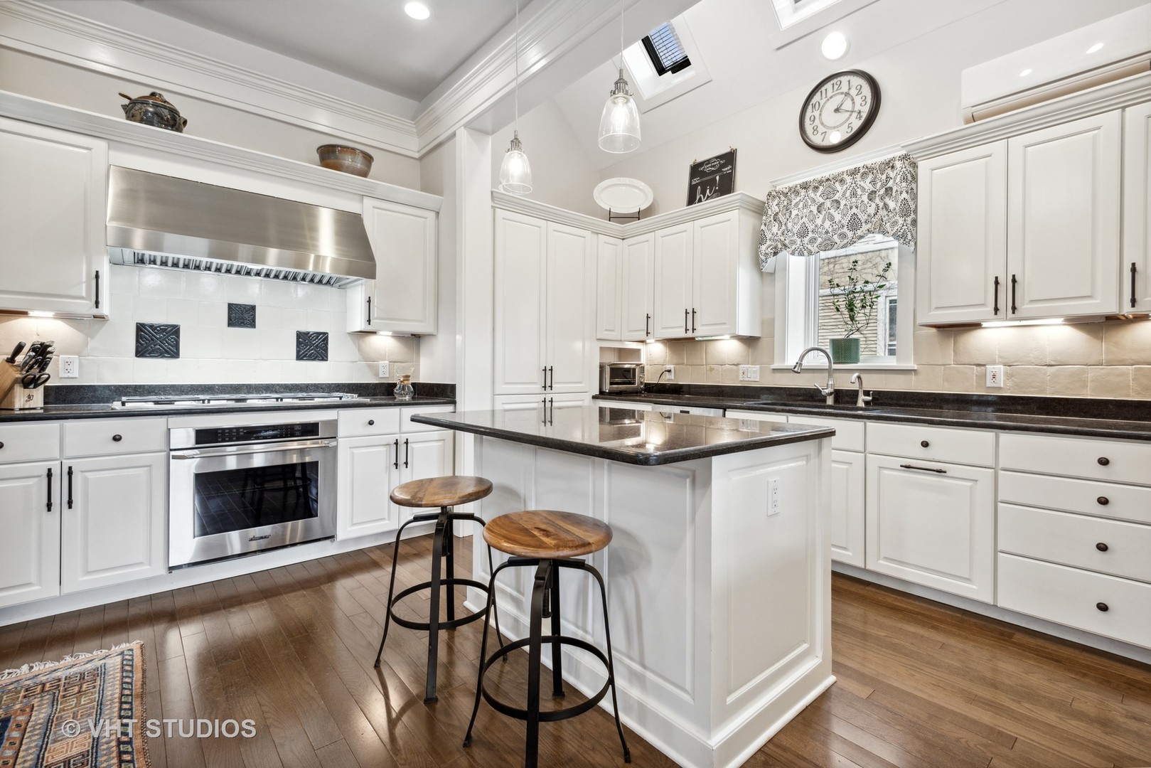 1224 Maple Avenue Evanston, IL 60202 - Photo 28 of 71 a kitchen with stainless steel appliances a stove a sink and cabinets