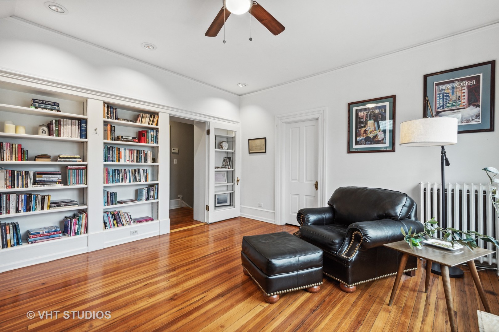 1224 Maple Avenue Evanston, IL 60202 - Photo 48 of 71 a living room with furniture hardwood floor and book shelf
