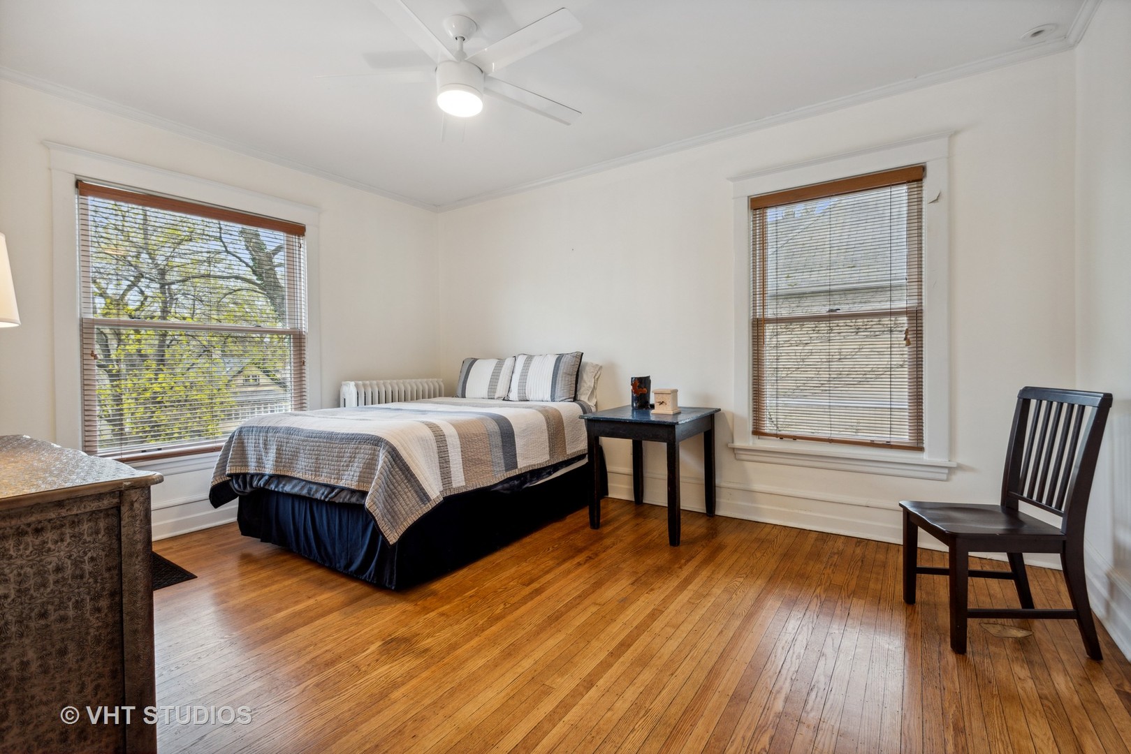 1224 Maple Avenue Evanston, IL 60202 - Photo 51 of 71 a bedroom with a bed and a chair