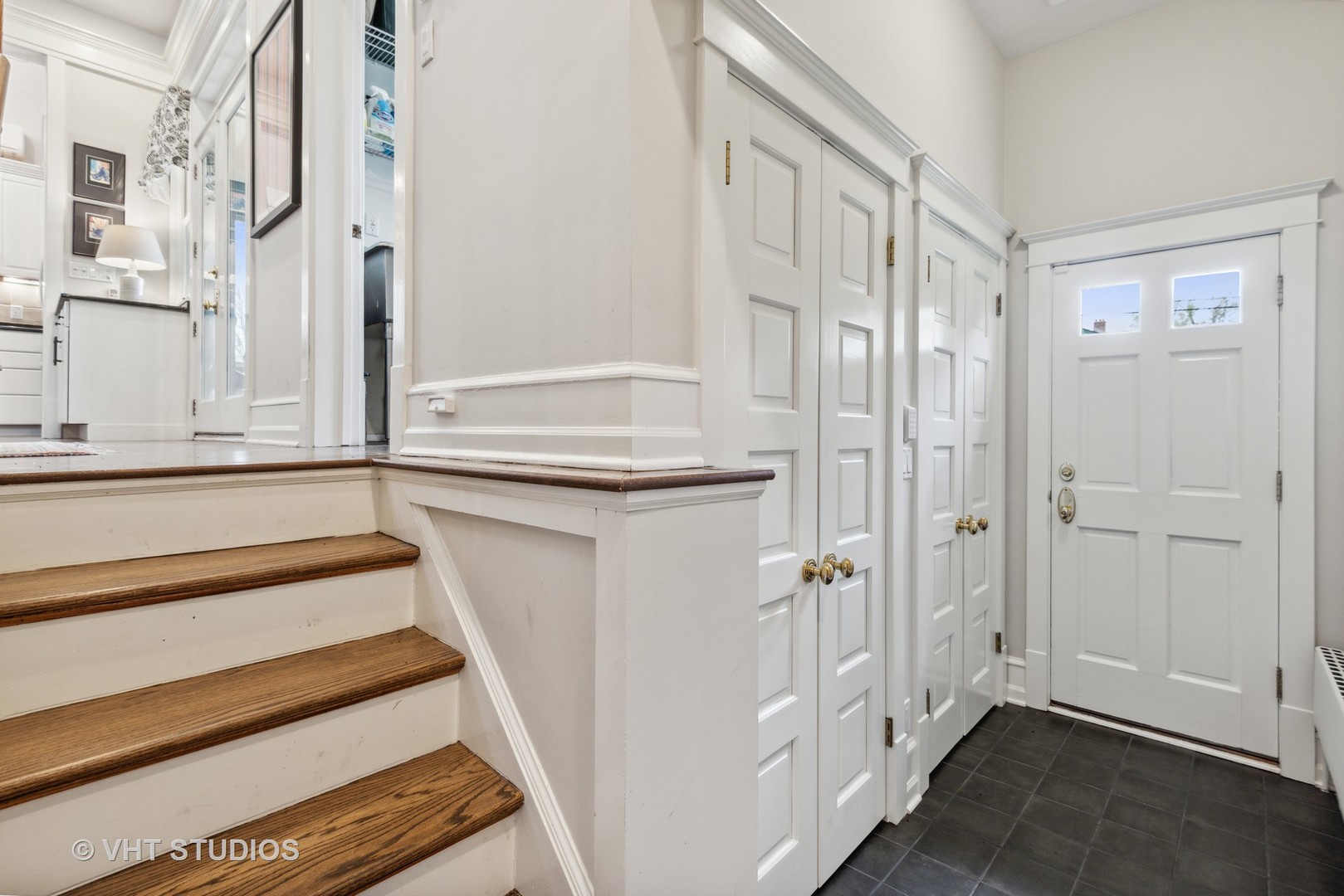 1224 Maple Avenue Evanston, IL 60202 - Photo 57 of 71 a view of an entryway with wooden floor and staircase