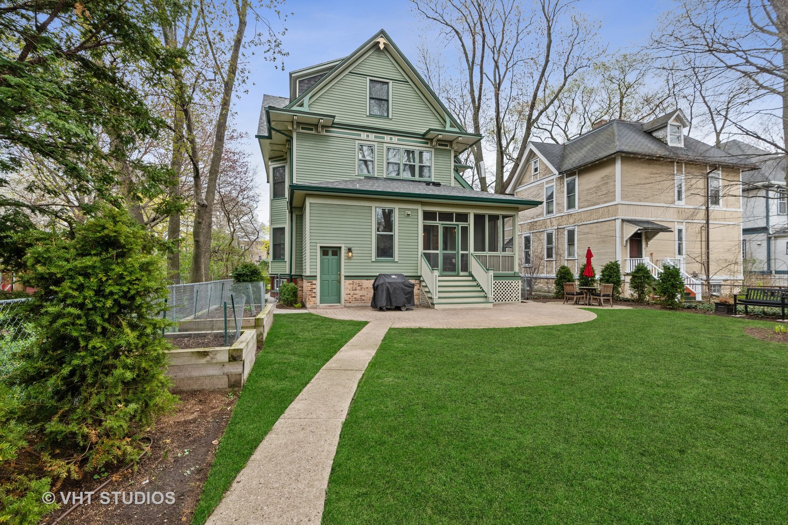 1224 Maple Avenue Evanston, IL 60202 - Photo 64 of 71 a front view of a house with a garden and plants